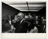 Cecil W. Stoughtons Personal, Unpublished 10 x 8 Photo of LBJs Inauguration Aboard Air Force One -- LBJ Takes the Oath of Office as Jackie Stands Witness